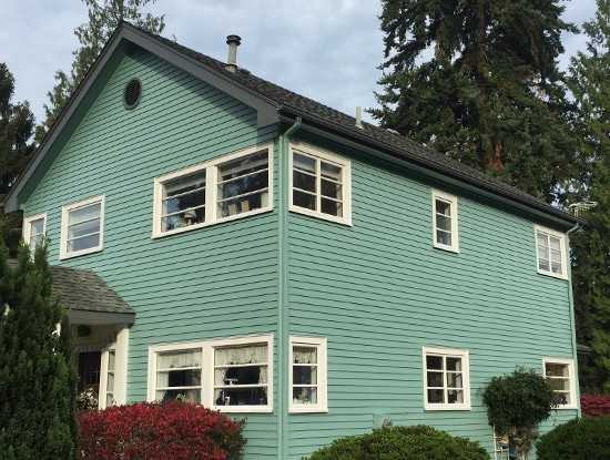 a beautiful home's exterior painting by Paintmaster Services