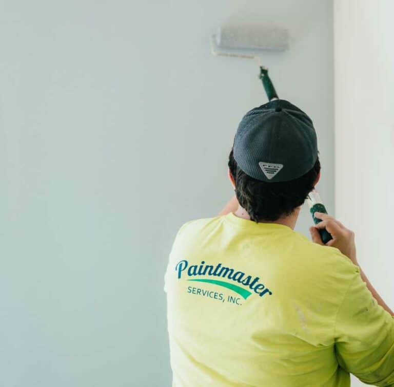 Paintmaster Services skilled painter doing residential interior painting